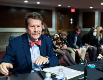 File photo: Dr. Robert Califf gathers his documents as the Senate Committee on Health, Education, Labor and Pension adjourn a hearing on the nomination of Califf to be Commissioner of Food and Drug Administration on Capitol Hill in Washington, on Dec. 14, 2021. (AP Photo/Manuel Balce Ceneta, File)