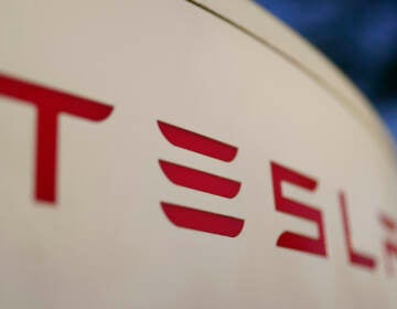 File photo: The logo for the Tesla Supercharger station is seen in Buford, Ga, April 22, 2021,. Tesla is recalling nearly 579,000 vehicles in the U.S. because sounds played over an external speaker can obscure audible warnings for pedestrians. The recall is the fourth made public in the last two weeks as U.S. safety regulators increase scrutiny of the nation’s largest electric vehicle maker