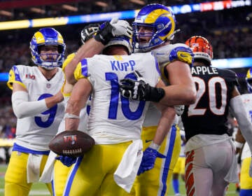 Los Angeles Rams wide receiver Cooper Kupp (10) is congratulated by teammates after scoring a touchdown against the Cincinnati Bengals during the second half of the NFL Super Bowl 56 football game Sunday, Feb. 13, 2022, in Inglewood, Calif. (AP Photo/Marcio Jose Sanchez)