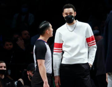 Brooklyn Nets' Ben Simmons, right, looks on during the second half of an NBA basketball game against the Sacramento Kings, Monday, Feb. 14, 2022, in New York. (AP Photo/Corey Sipkin)