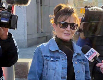Former Alaska Gov. Sarah Palin leaves a courthouse in New York, Tuesday, Feb. 15, 2022. Palin lost her libel lawsuit against The New York Times on Tuesday when a jury rejected her claim that the newspaper maliciously damaged her reputation by erroneously linking her campaign rhetoric to a mass shooting.