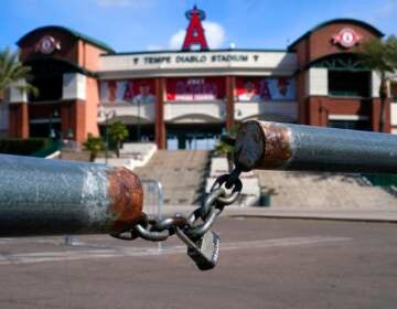 The main parking lot at the Los Angeles Angels Tempe Diablo Stadium remains closed as pitchers and catchers are not starting spring training workouts as scheduled as the Major League Baseball lockout enters its 77th day and will prevent pitchers and catchers from taking the field for the first time since October in Tempe, Ariz., Wednesday, Feb. 16, 2022. (AP Photo/Ross D. Franklin)