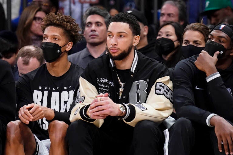 Brooklyn Nets forward Ben Simmons sits on the bench during the second half of an NBA basketball game against the New York Knicks, Wednesday, Feb. 16, 2022, in New York. (AP Photo/John Minchillo)