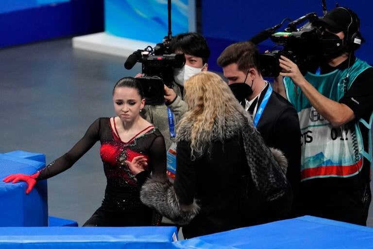 Kamila Valieva, of the Russian Olympic Committee, talks with her coach Eteri Tutberidze after the women's free skate program during the figure skating competition at the 2022 Winter Olympics, Thursday, Feb. 17, 2022, in Beijing