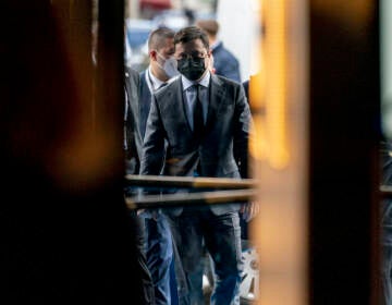 Ukrainian President Volodymyr Zelenskyy walks into the Bayerischer Hof Hotel after meeting with Vice President Kamala Harris during the Munich Security Conference, Saturday, Feb. 19, 2022, in Munich. (AP Photo/Andrew Harnik, Pool)