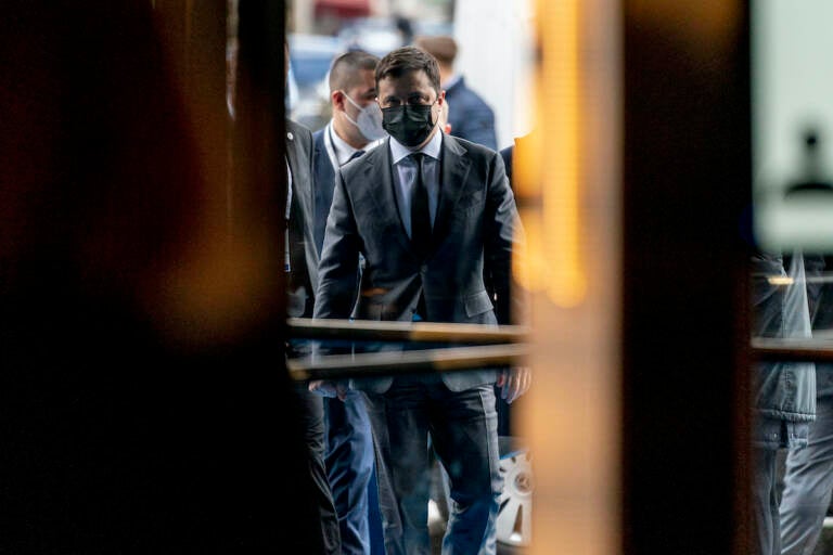 Ukrainian President Volodymyr Zelenskyy walks into the Bayerischer Hof Hotel after meeting with Vice President Kamala Harris during the Munich Security Conference, Saturday, Feb. 19, 2022, in Munich. (AP Photo/Andrew Harnik, Pool)