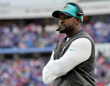 Miami Dolphins head coach Brian Flores watches from the sideline during the first half of an NFL football game against the Buffalo Bills, Sunday, Oct. 31, 2021, in Orchard Park, N.Y. (AP Photo/Adrian Kraus)