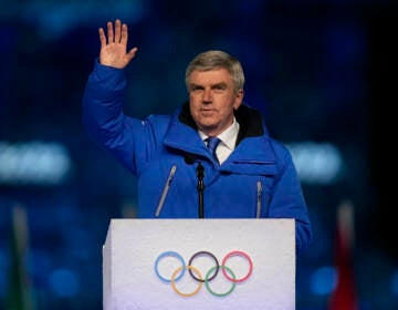 International Olympic Committee President Thomas Bach waves during the closing ceremony of the 2022 Winter Olympics, Sunday, Feb. 20, 2022, in Beijing