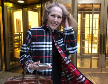 Columnist E. Jean Carroll leaves federal court Tuesday Feb. 22, 2022, in New York. Carroll, who accused former President Donald Trump of raping her in the mid-1990s and then filed a defamation lawsuit against him, will not seek to depose him prior to trial because it would cause unnecessary delay, but she added that a DNA sample was still being sought. (AP Photo/Larry Neumeister)