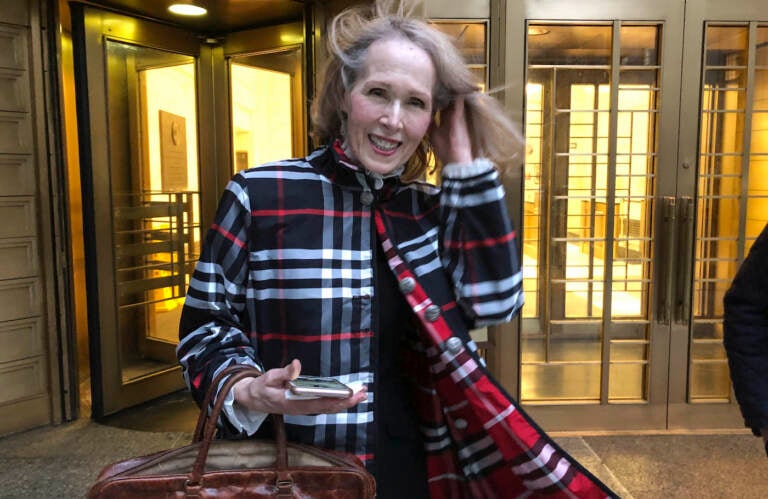 Columnist E. Jean Carroll leaves federal court Tuesday Feb. 22, 2022, in New York. Carroll, who accused former President Donald Trump of raping her in the mid-1990s and then filed a defamation lawsuit against him, will not seek to depose him prior to trial because it would cause unnecessary delay, but she added that a DNA sample was still being sought. (AP Photo/Larry Neumeister)