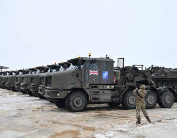Tanks uploaded on military truck platforms as a part of additional British troops and military equipment arrive at Estonia's NATO Battle Group base in Tapa, Estonia, Friday, Feb. 25, 2022. With Ukrainian President Volodymyr Zelenskyy appealing for help, NATO members ranging from Russia’s neighbor Estonia in the north down to Bulgaria on the Black Sea coast triggered urgent consultations about their security