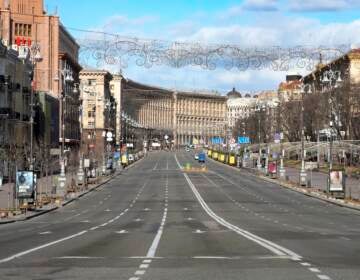 A view of Khreshchatyk, the main street, empty, due to curfew in the central of Kyiv, Ukraine, Sunday, Feb. 27, 2022. A Ukrainian official says street fighting has broken out in Ukraine's second-largest city of Kharkiv. Russian troops also put increasing pressure on strategic ports in the country's south following a wave of attacks on airfields and fuel facilities elsewhere that appeared to mark a new phase of Russia's invasion. (AP Photo/Efrem Lukatsky)