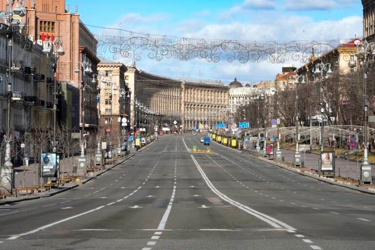 A view of Khreshchatyk, the main street, empty, due to curfew in the central of Kyiv, Ukraine, Sunday, Feb. 27, 2022. A Ukrainian official says street fighting has broken out in Ukraine's second-largest city of Kharkiv. Russian troops also put increasing pressure on strategic ports in the country's south following a wave of attacks on airfields and fuel facilities elsewhere that appeared to mark a new phase of Russia's invasion. (AP Photo/Efrem Lukatsky)