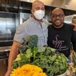 Chef Yuhnis Sydnor with Rhys Enoch, one of his live audience participants during Sydnor's cooking class about soul food. (Photo courtesy of the Culinary Literacy Center)