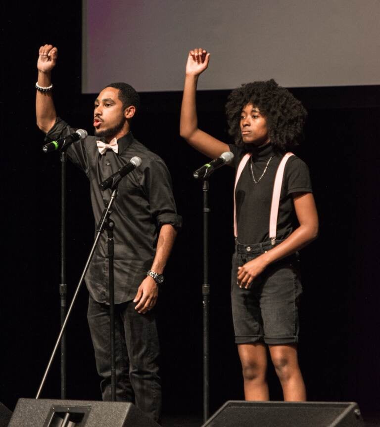 DeeSoul Carson (left), performs a group poem at the College Unions Poetry Slam Invitational (CUPSI). (Photo courtesy of DeeSoul Carson)