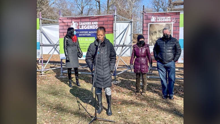 Latoya Hackney, wife of Otis Hackney, accepts the honor Saturday during Smith Memorial Playground’s program in East Fairmount Park. Frances Hoover, Smith Playground executive director, City Councilmember Helen Gym and Mayor Jim Kenney were also on hand for the 'Leaders and Legends of Philadelphia' program. (O.J. Spivey/The Philadelphia Tribune)