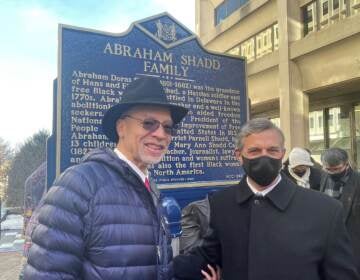 Janmichael Shadd Graine (left) with Gov. John Carney, stands at the new historic marker honoring his great great great great grandfather. (Cris Barrish/WHYY)