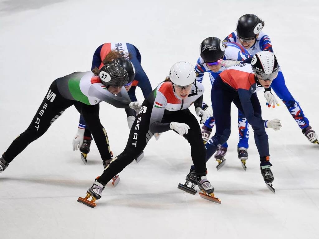 FILE - Team Hungary, left and first place, Team Russia, rear right and second place, and Team France, front right, rear left, and third place, compete during the 2,000-meter mixed relay race of the World Cup short track speed skating championship in Dresden, eastern Germany, on Feb. 8, 2020. Short track speedskating is already thrilling with its high-speed crashes and elbows flying. Now, there's a new event adding to the chaos with its Olympic debut in Beijing, the mixed relay race