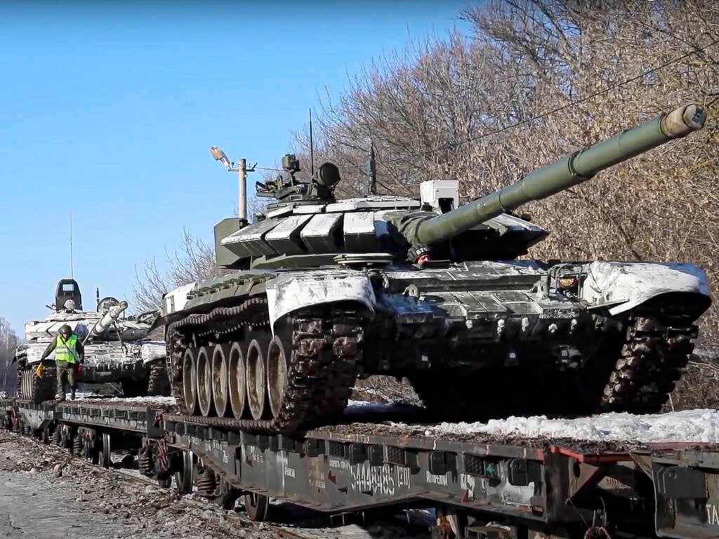Russian army tanks are loaded onto railway platforms