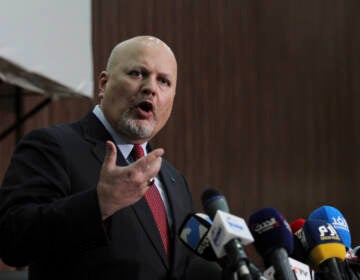 Karim Ahmed Khan, International Criminal Court chief prosecutor, speaks during a news conference at the Ministry of Justice in the Khartoum, Sudan, last August. The International Criminal Court's prosecutor has put combatants and their commanders on notice that he is monitoring Russia's invasion of Ukraine and has jurisdiction to prosecute war crimes and crimes against humanity. (Marwan Ali/AP)