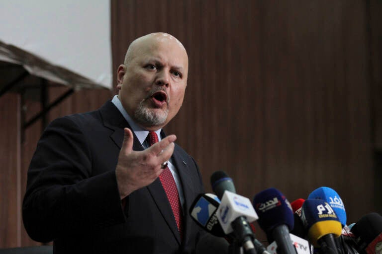 Karim Ahmed Khan, International Criminal Court chief prosecutor, speaks during a news conference at the Ministry of Justice in the Khartoum, Sudan, last August. The International Criminal Court's prosecutor has put combatants and their commanders on notice that he is monitoring Russia's invasion of Ukraine and has jurisdiction to prosecute war crimes and crimes against humanity. (Marwan Ali/AP)