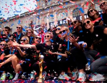 Members of the World Cup-winning U.S. women's team take part in a ticker tape parade