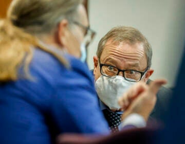 Greg McMichael, center, listens to his attorney Franklin Hogue during the sentencing of he and his son Travis McMichael, and a neighbor, William 