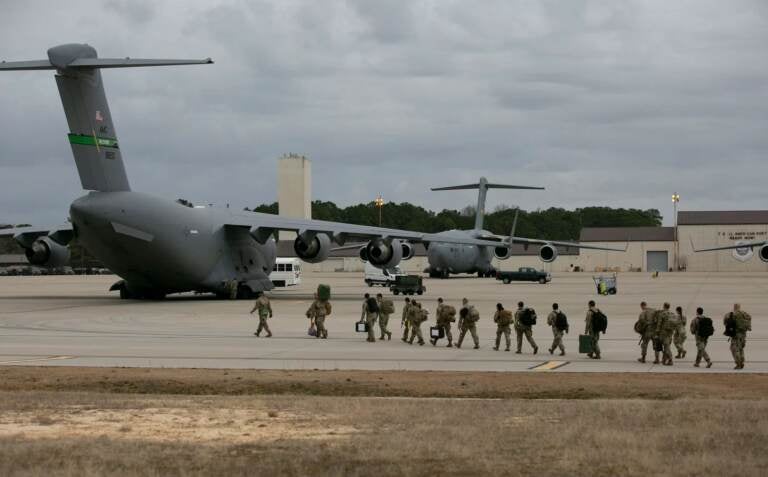 U.S. troops depart Fort Bragg, N.C., Thursday for deployment in Europe as part of the U.S. response to the tensions around Ukraine. US troops deploy for Europe from Pope Army Airfield at Fort Bragg, North Carolina, on February 3, 2022. (Photo by Allison Joyce / AFP) (Photo by ALLISON JOYCE/AFP via Getty Images)