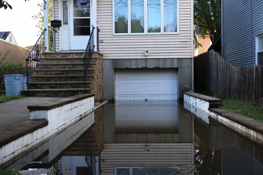 Floodwaters are seen in front of a New Jersey home