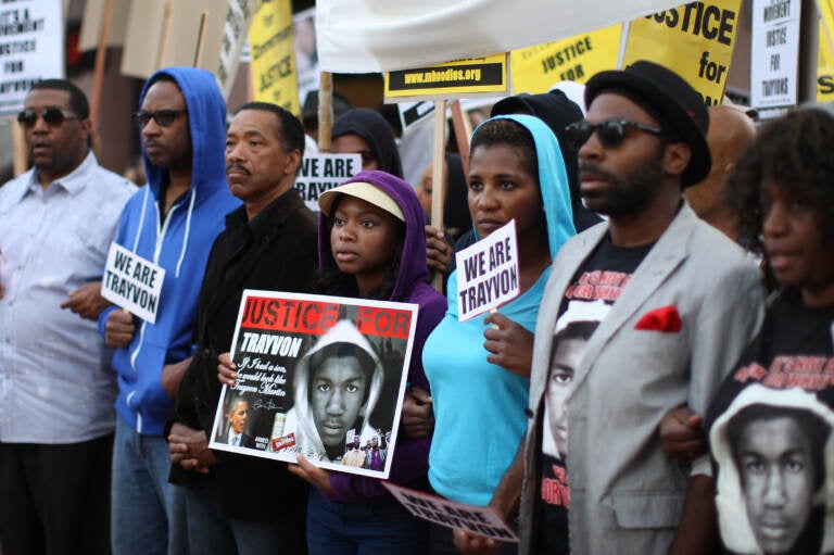 People in Los Angeles walk in a silent protest march on April 9, 2012, to demand justice for the killing of Trayvon Martin. (David McNew/Getty Images)