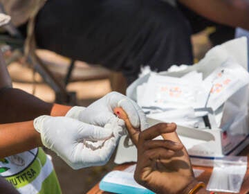 Testing blood for malaria at a Doctors Without Borders clinic in Malawi. (Ashley Cooper/Getty Images)