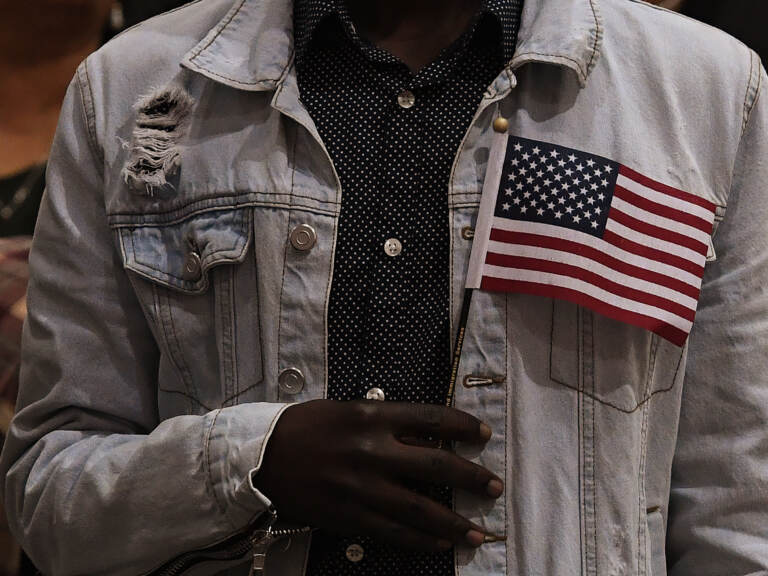 People pledge allegiance to America as they receive U.S. citizenship at a naturalization ceremony for immigrants in Los Angeles in 2017. (Mark Ralston/AFP via Getty Images)