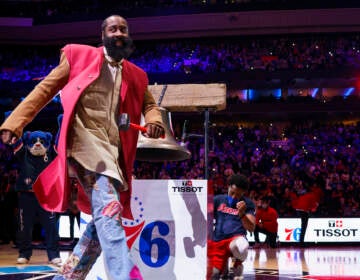 Philadelphia 76ers' James Harden reacts to ringing the bell before the team's NBA basketball game against the Boston Celtics, Tuesday, Feb. 15, 2022, in Philadelphia. (AP Photo/Chris Szagola)