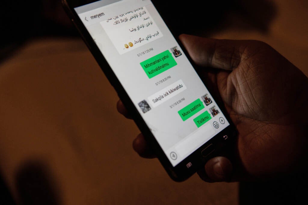 Abdullatif Kuçar shows text messages he exchanged with his wife