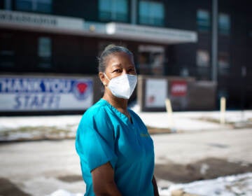 Pat Johnson wears a face mask outside