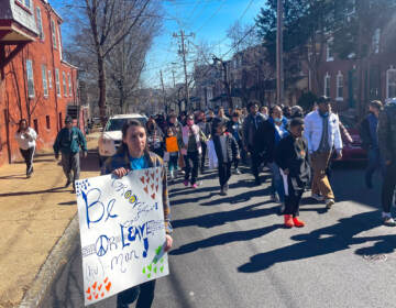 Marchers walk for peace and unity on the West Side of Wilmington. (Cris Barrish/WHYY)