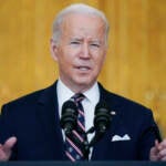 President Joe Biden speaks from a podium