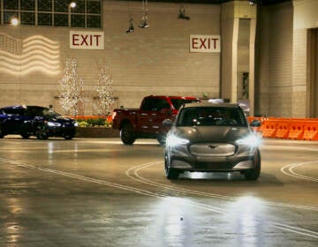 Electric vehicles wind around a 50,000-square-foot track