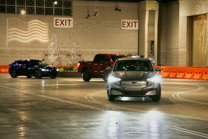 Electric vehicles wind around a 50,000-square-foot track