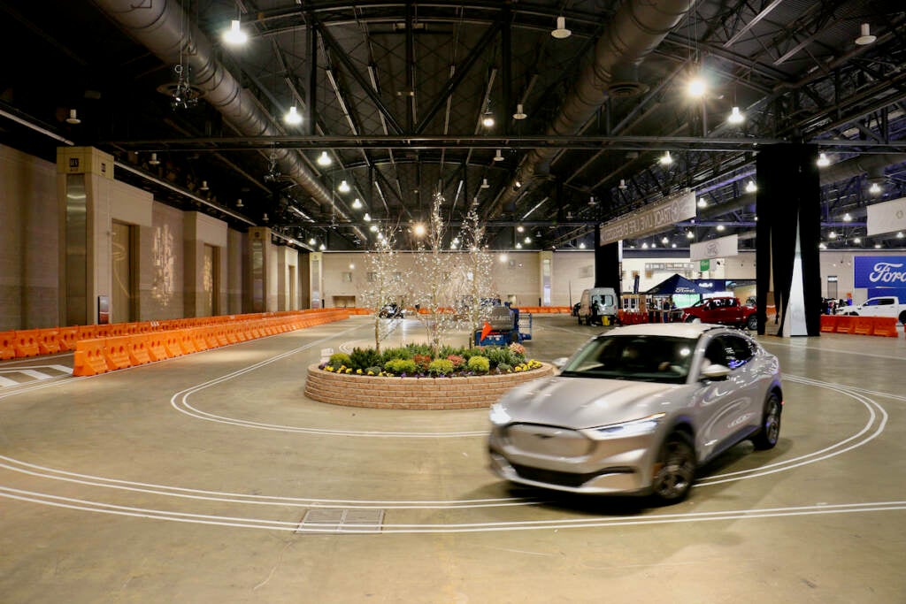 A 2023 Mustang Mach-E makes its way around the 50,000-square-foot electric vehicle track