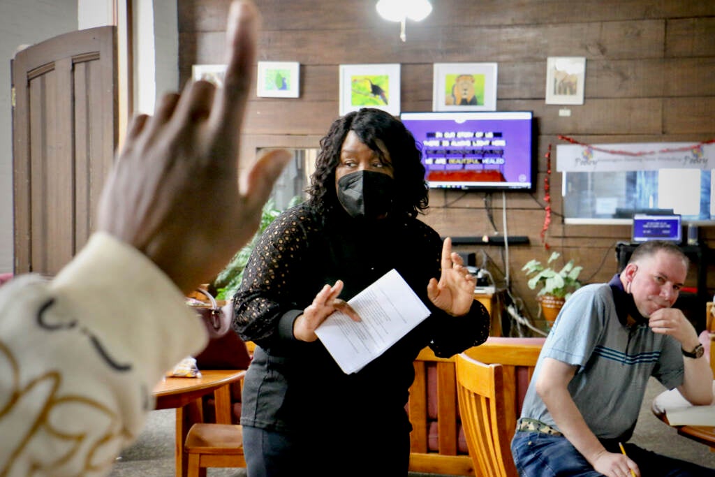 Former Philadelphia Poet Laureate Trapeta Mayson leads a poetry workshop at the Open Door Clubhouse in Kensington