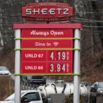 Gas prices are shown on a Sheetz billboard, with prices listed as $4.19 a gallon.