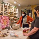 People participate in a fabric dyeing workshop at Modest Transitions
