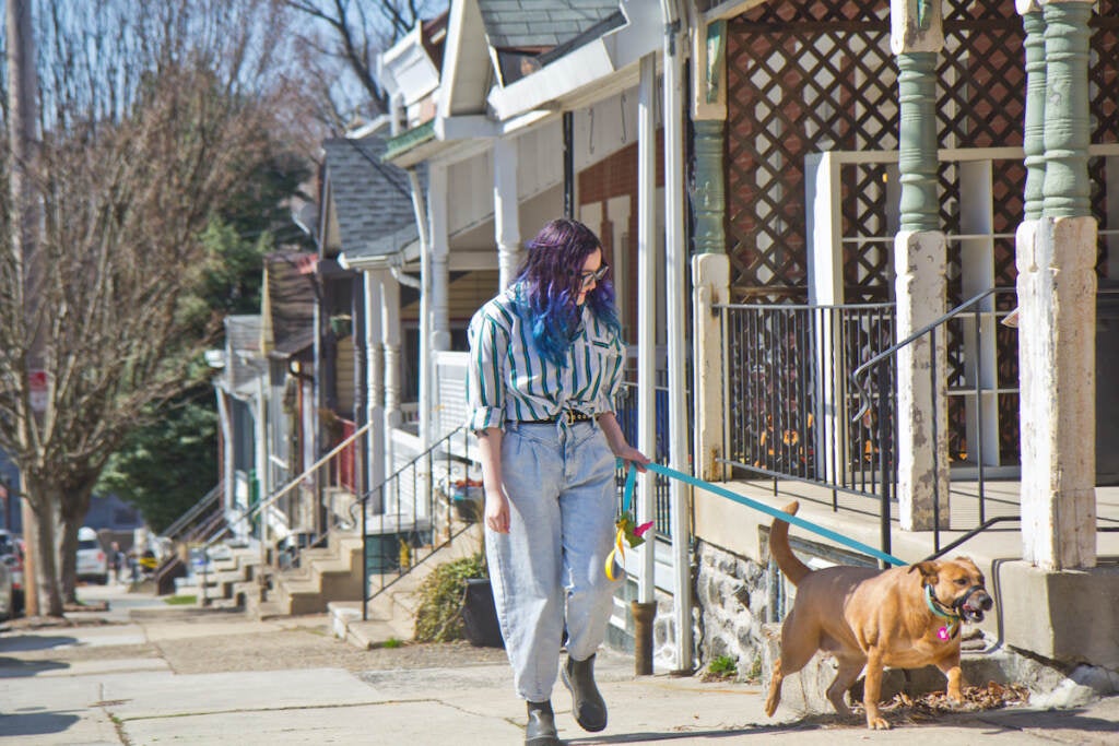 Scarlett DeLorme walks her dog in Philadelphia
