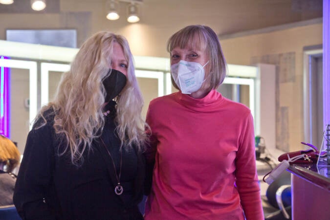 Judy Kozulak (right) and stylist Lorraine Keane (left) at Perry Anthony Salon & Spa in Wilmington, Del., on March 14, 2022. Kouzulak is severely immunocompromised, and hasn’t been inside public spaces since 2020. (Kimberly Paynter/WHYY)