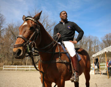 Kareem Rosser sits on top of a horse in Fairmount Park