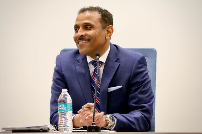 Tony Watlington Sr. sits at a table