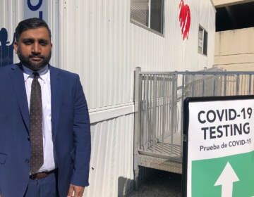 Azmat Husain stands at a COVID-19 testing site