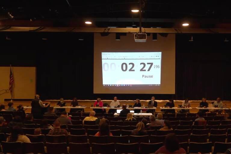 Resident Jenifer MacFarland (pictured far left at the podium) makes a public comment — and hand delivers a Right to Know Law request to the West Chester Area School District seeking information on LGBTQ students