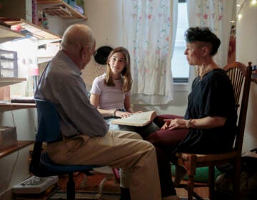 Nomi Kline Solmeson prepares for her bat mitzvah, reading the Torah in her bedroom with her grandfather, Rabbi David Kline, and her aunt Shira Kline.